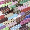 A collection of colorful grid pattern decorative washi paper stickers in various shades of pink, green, purple, and brown.