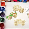A collection of unfinished wood monster truck cutouts for DIY crafts, including a yellow and green vehicle.