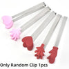 A set of pink and red wooden clip beads used for a test tube toy fine motor skills game.