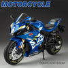 A blue Suzuki ECSTAR diecast motorcycle model with lights and suspension on a display stand.