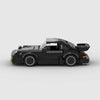 A black classic rally car model built from LEGO bricks.