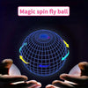 A hand is holding a glowing blue sphere with internal lines, demonstrating the magic spin fly ball toy.