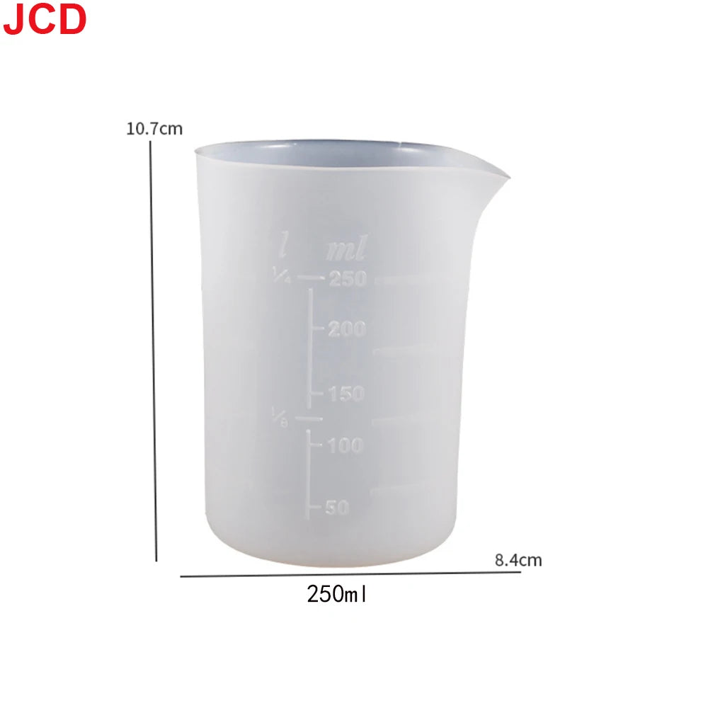A white flexible silicone measuring cup with volume markings, shown next to its dimensions.