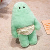 A soft mint green monster plush doll with a ruffled white pant detail.
