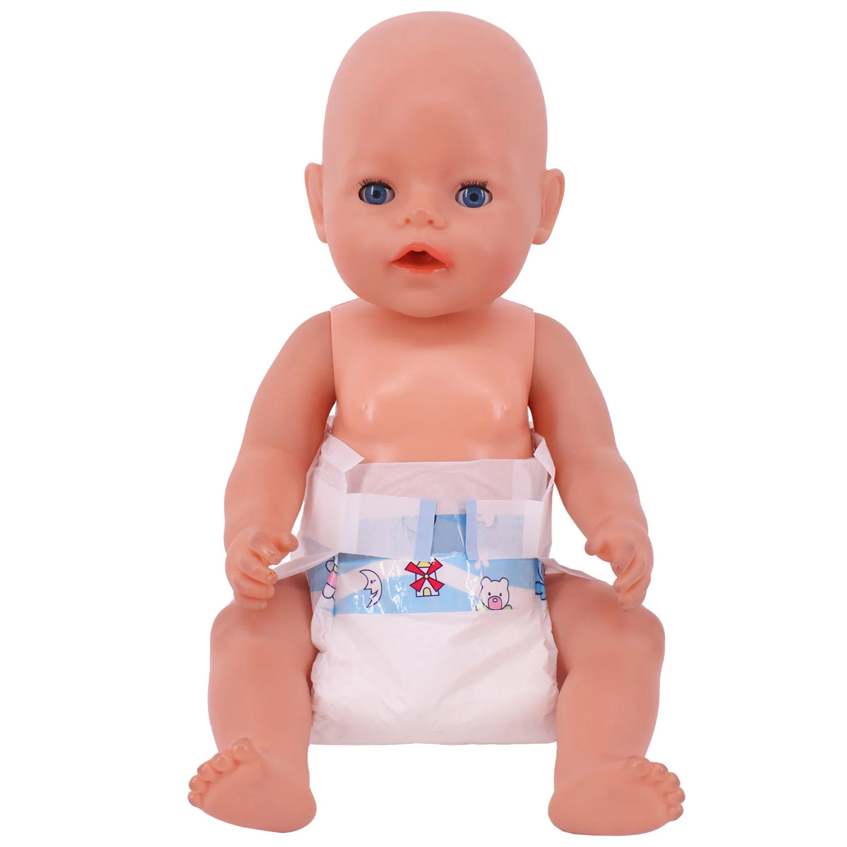 A pink baby doll with blue eyes wearing a white feeding bib and sitting down.