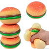A set of colorful, squishy stress balls shaped like hamburgers in various colors and textures.