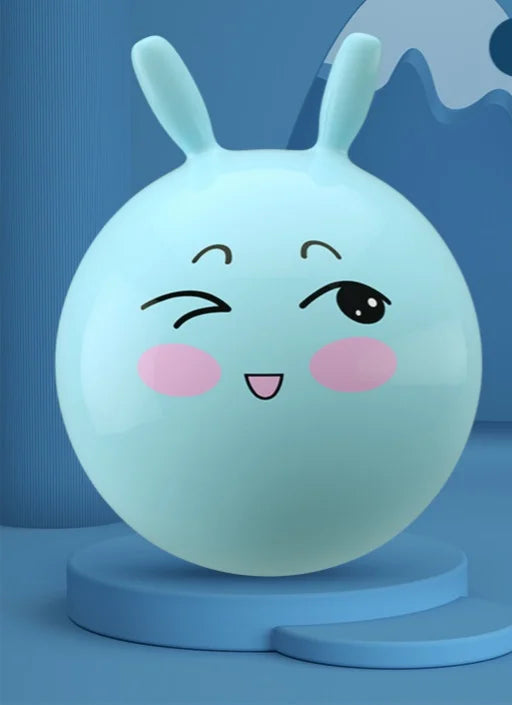 A light blue inflatable hopper ball with bunny ears is shown on a blue stand.