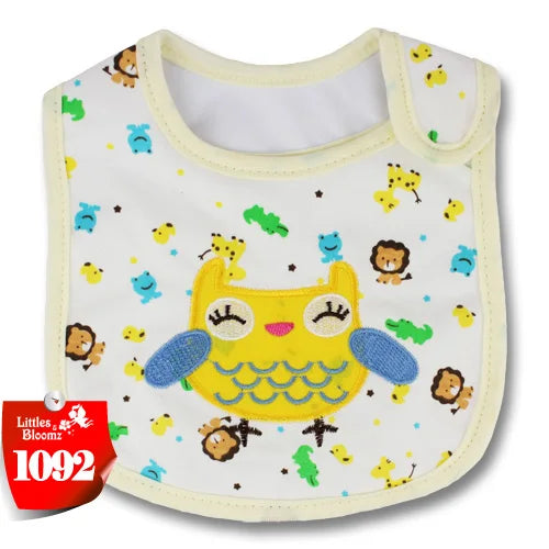 A yellow cartoon owl baby feeding bib with a white background and green accents.