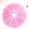 A pink sparkling tutu dress for girls with a full, radiating skirt and a small black accessory.