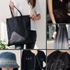 A set of five black and gray gradient polka dot rhinestone sticker sheets displayed on a white canvas bag.