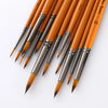 A set of ten round paint brushes with wooden handles and metal ferrules, shown diagonally on a white background.