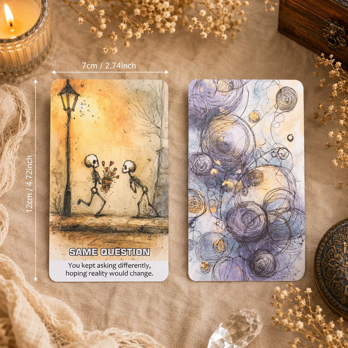 A square oracle card featuring a silhouette of two figures and swirling purple and gold abstract patterns on a light backgrou