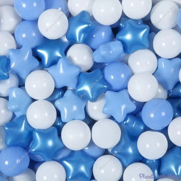 A close-up of various blue and white star-shaped play balls for kids.