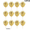 Twelve artificial golden tropical palm leaves used for party decoration