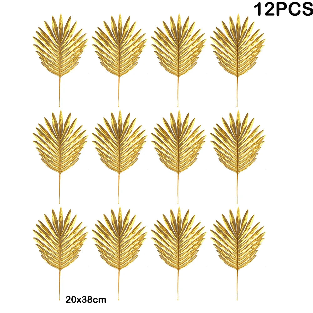 Twelve artificial golden tropical palm leaves used for party decoration