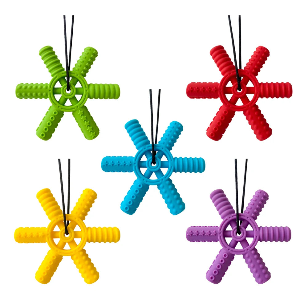 A set of five silicone steering wheel teethers in various colors including green, red, yellow, blue, and purple.