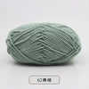 A ball of soft, light green pre-dyed milk cotton yarn with 62 strands.
