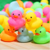 Assorted mini silicone rubber ducks in various bright colors like pink yellow and green