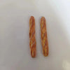 Two miniature baguette loaves used for dollhouse kitchens