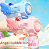 A hand holds a pink bubble gun, ready to shoot bubbles against a bright blue sky.