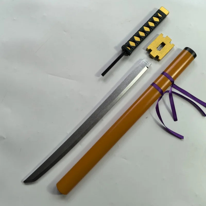 A long, slender katana prop with a wooden handle and a black sheath, accompanied by a gold-colored blade guard.