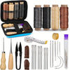 A collection of leather sewing and repair tools including waxed thread spools, needles, and various leather components.