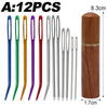 A set of 12 stainless steel sewing needles in various colors stored in a wooden tube.