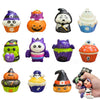 A collection of ten Halloween-themed fidget toys shaped like skulls, pumpkins, and cupcakes in various colors.