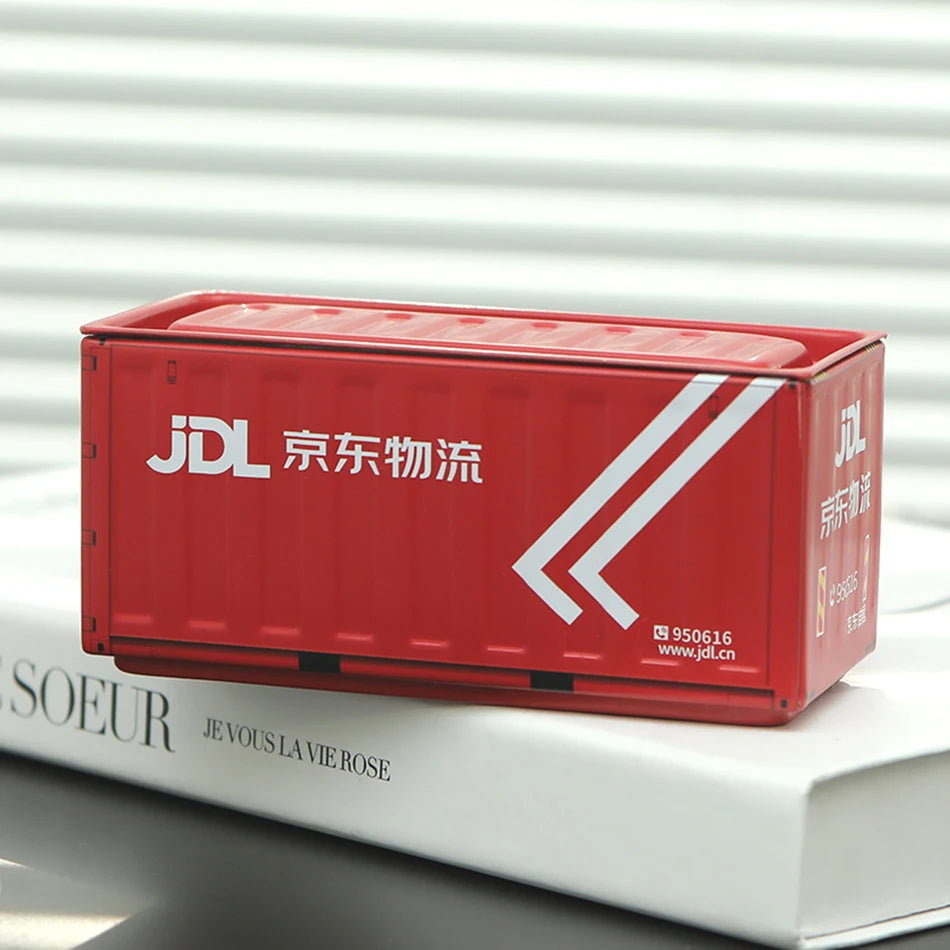 A red DHL shipping box with white text and arrows resting on a white book.