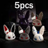 Five gothic bunny plush keychains with bandages and ears displayed on a dark surface.