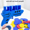 Blue EVA foam bullets loaded into a toy gun, with loose blue and yellow discs scattered nearby.
