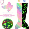 A glow-in-the-dark mermaid tail blanket for kids showing a pink and green iridescent pattern on a fabric.