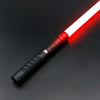 A white lightsaber toy with a red glow is shown diagonally on a dark surface.