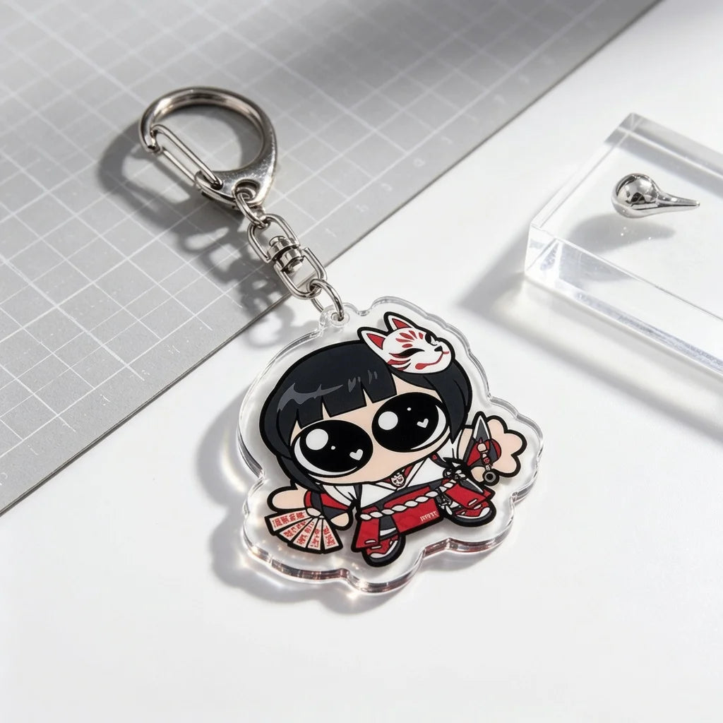 A clear acrylic keychain charm featuring an anime-style character with black hair and white markings, attached to a silver ke