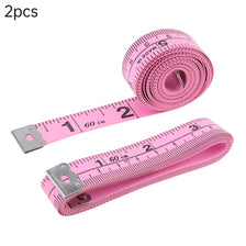 A pink soft tape measure set with two rolls and a flexible measuring tape for sewing and body measurements