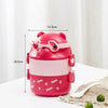 A pink bear-shaped stackable bento lunch box with glasses for kids, shown on a white surface.