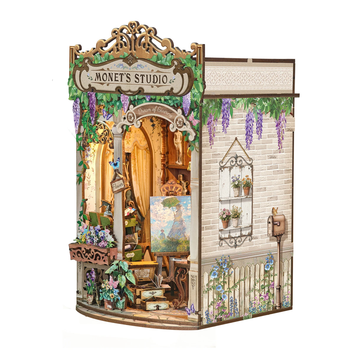 A miniature wooden book nook kit depicting Monet's studio with greenery and antique elements.