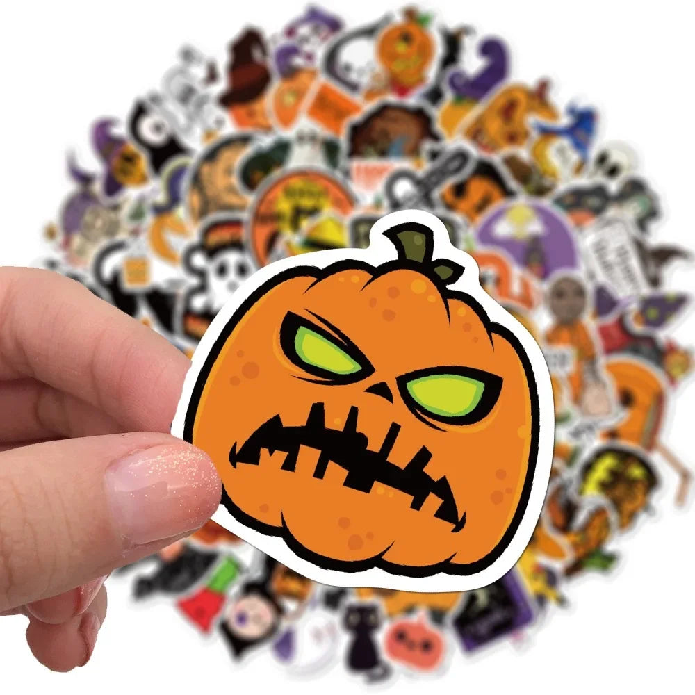 A hand holds a Halloween carved pumpkin sticker surrounded by various themed stickers.