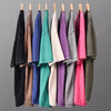 A display of various colored men's retro washed heavyweight cotton t-shirts hanging on hangers.
