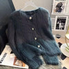 A dark teal fuzzy knit cardigan sweater displayed on a hanger.