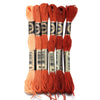 A set of six skeins of vibrant orange embroidery thread for cross stitch and DIY crafts.