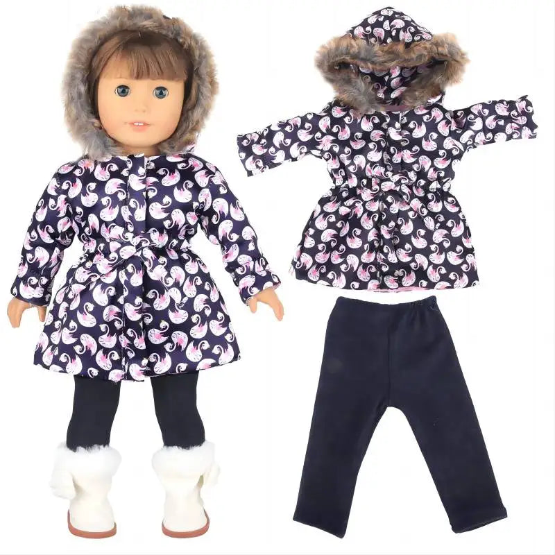 A doll wearing a dark blue and pink floral winter coat dress with a fur hood and black leggings.
