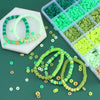 Assortment of colorful clay and alphabet beads in various shades of green and lime, with finished beaded bracelets displayed.