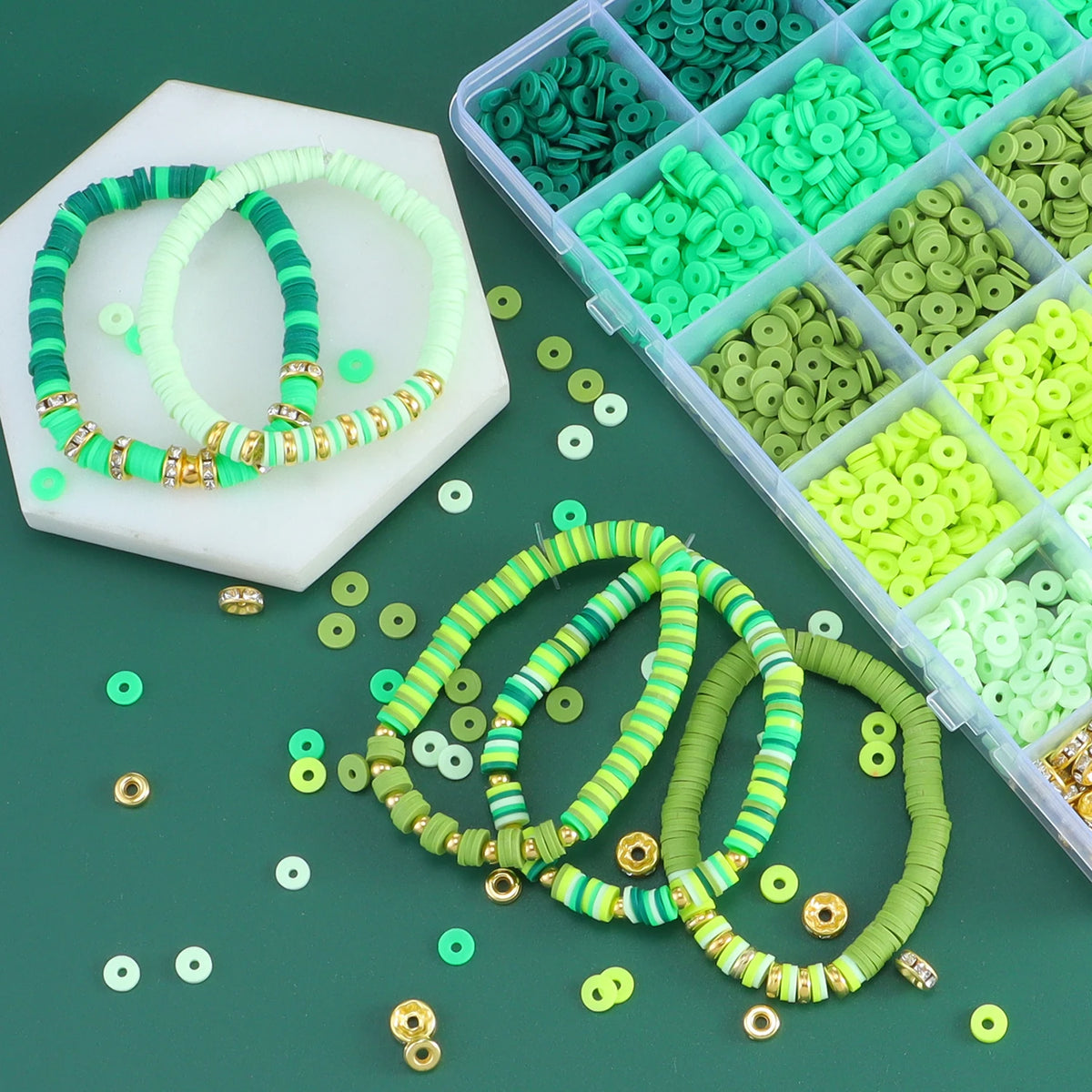 Assortment of colorful clay and alphabet beads in various shades of green and lime, with finished beaded bracelets displayed.
