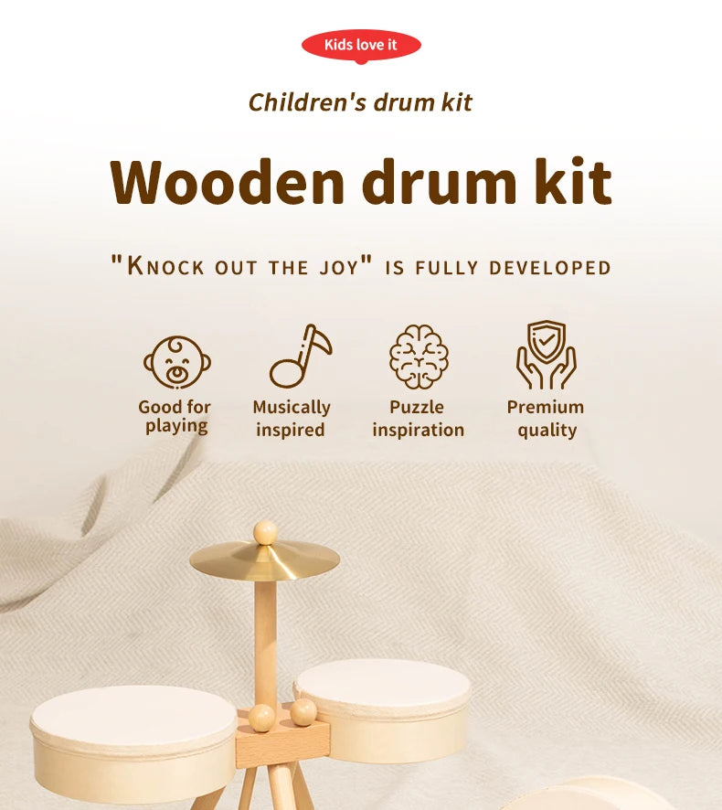 A wooden drum kit set with various components displayed on a light fabric background.