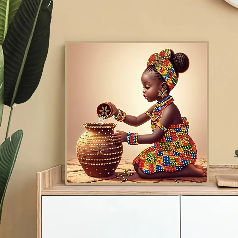 A young African girl is painting a ceramic jar with diamonds, wearing traditional attire and a patterned headwrap.