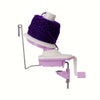 A purple hand crank yarn winder with a white base and pink accents for knitting and crochet projects.