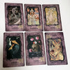 A set of nine purple oracle cards featuring illustrations and titles like Initiation, Boundaries, Serenity, Solitude, Duality