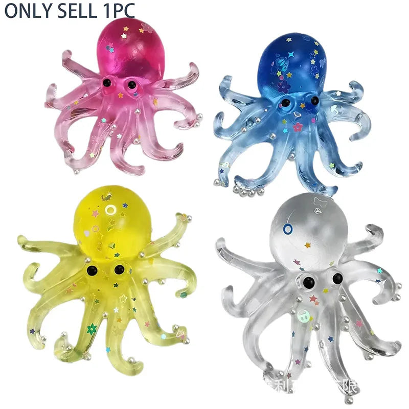 Four colorful octopus stress relief squishy toys in pink, blue, yellow, and silver.