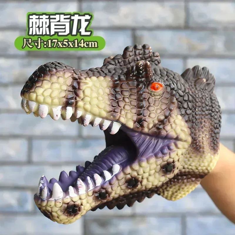 A realistic soft toy of a Tyrannosaurus Rex dinosaur hand puppet with textured skin and open mouth.
